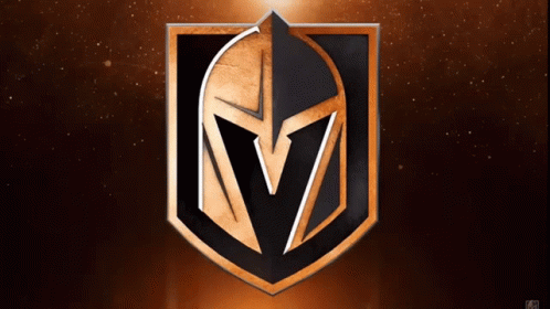 A Black And Gold Shield With A Spartan Helmet On It GIF