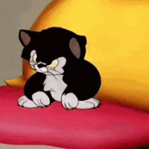 A Black And White Cartoon Cat Is Sitting On A Pink Pillow . GIF