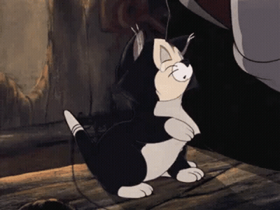A Black And White Cartoon Cat Is Sitting On A Wooden Floor Next To A Person . GIF
