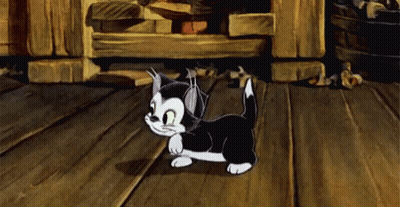A Black And White Cartoon Cat Walking On A Wooden Floor GIF