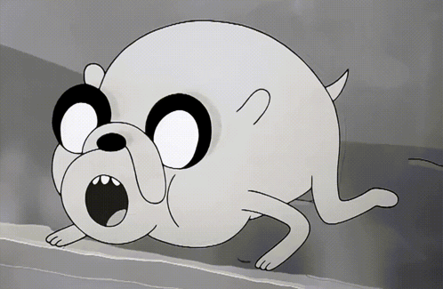 A Black And White Cartoon Dog With A Surprised Expression On His Face GIF