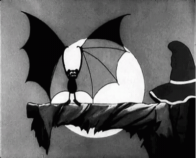A Black And White Cartoon Of A Bat Sitting On A Branch . GIF