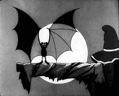A Black And White Cartoon Of A Bat Sitting On A Branch . GIF