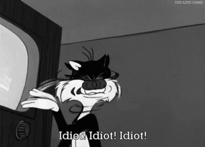 A Black And White Cartoon Of A Cat Saying Idiot GIF