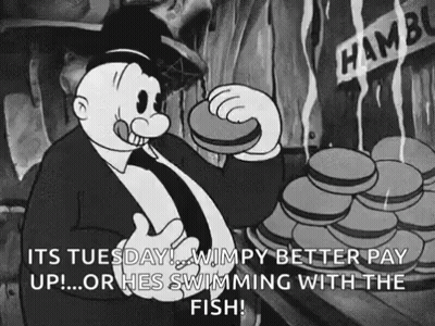 A Black And White Cartoon Of A Man Eating A Hamburger And Saying `` It 'S Tuesday ! '' GIF