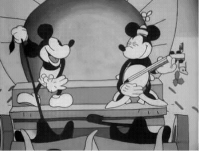 A Black And White Cartoon Of Mickey Mouse Playing A Guitar GIF