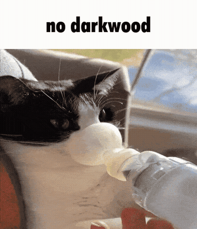 A Black And White Cat Drinking From A Bottle With The Words " No Darkwood " Above It GIF