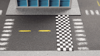 A Black And White Checkered Race Track With A Yellow Line GIF