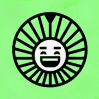 A Black And White Circle With A Smiley Face In The Middle On A Green Background . GIF