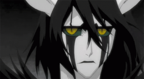 A Black And White Drawing Of A Cartoon Character With Horns And Yellow Eyes GIF