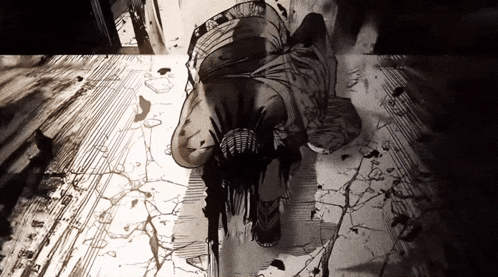 A Black And White Drawing Of A Man Laying On The Floor GIF