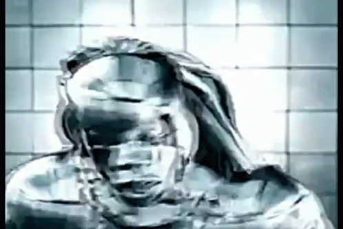 A Black And White Drawing Of A Man With A Hood On His Head . GIF