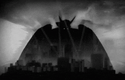 A Black And White Drawing Of A Monster With Horns GIF