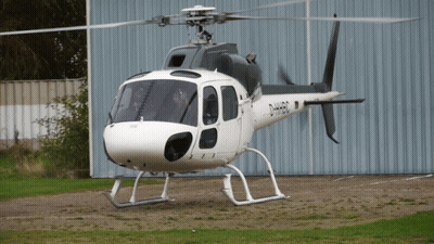 A Black And White Helicopter With The Letters D-Hh50 On The Side GIF