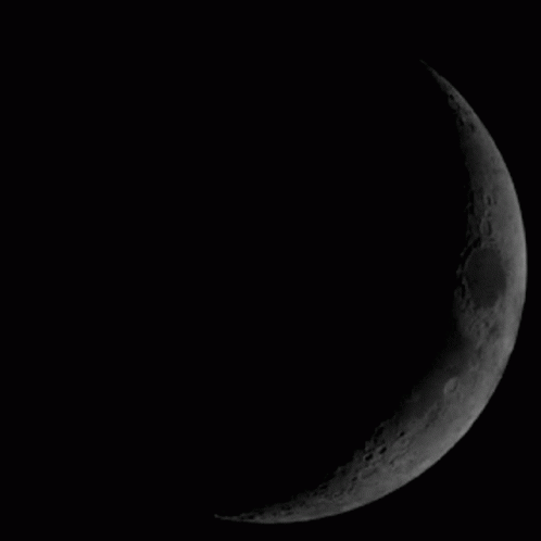A Black And White Image Of A Full Moon GIF