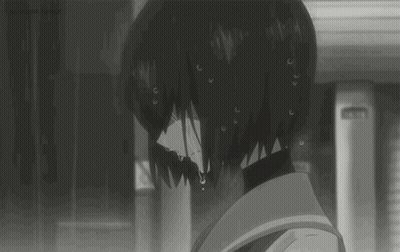 A Black And White Image Of A Girl Crying In The Rain . GIF