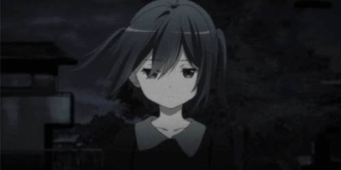 A Black And White Image Of A Girl With Pigtails Looking At The Camera GIF