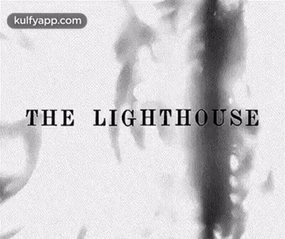 A Black And White Image Of A Lighthouse With Smoke Coming Out Of It GIF