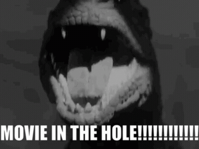 A Black And White Image Of A Monster With The Words Movie In The Hole Written Below It GIF