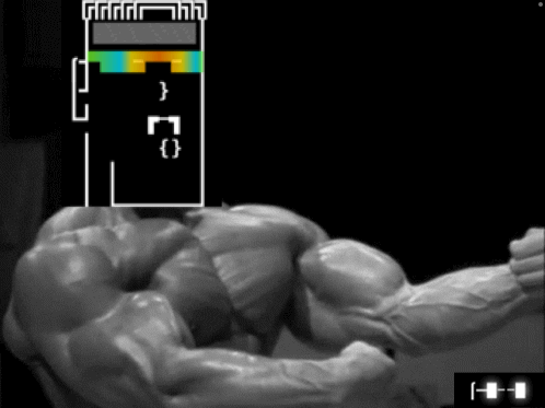 A Black And White Image Of A Muscle Man With A Tetris Game On The Screen GIF