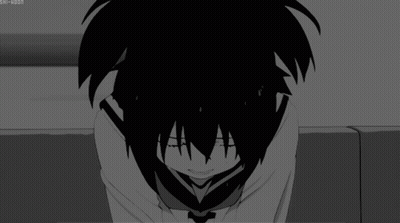 A Black And White Image Of A Person Covering Their Face GIF