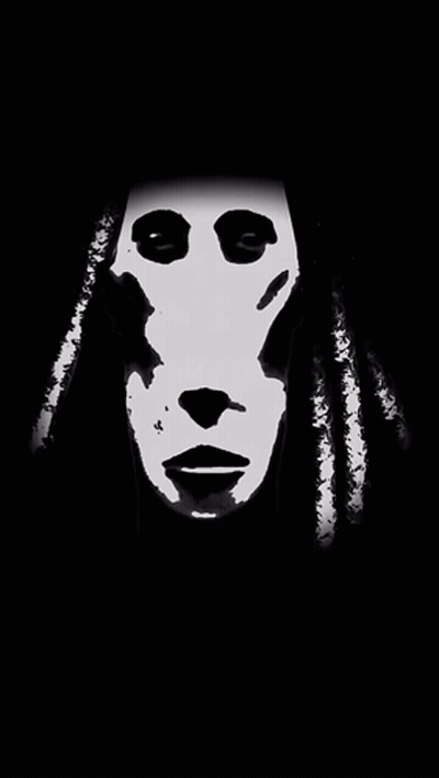 A Black And White Image Of A Person 'S Face With Dreadlocks GIF