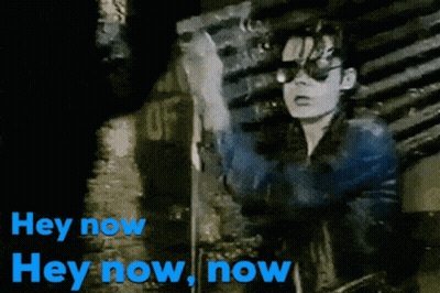 A Black And White Image Of A Person With The Words Hey Now In Blue GIF