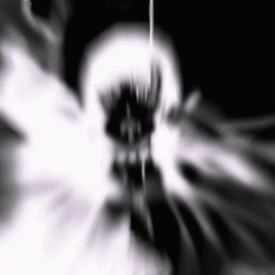 A Black And White Image Of A Skull With A Glowing Mouth And Teeth . GIF