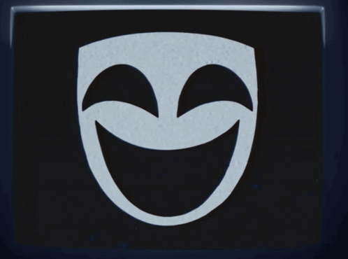 A Black And White Mask With Tears Coming Out Of Its Eyes GIF