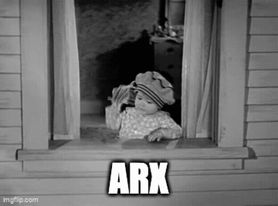 A Black And White Photo Of A Baby In A Hat Looking Out Of A Window With The Word Arx Above Him . GIF