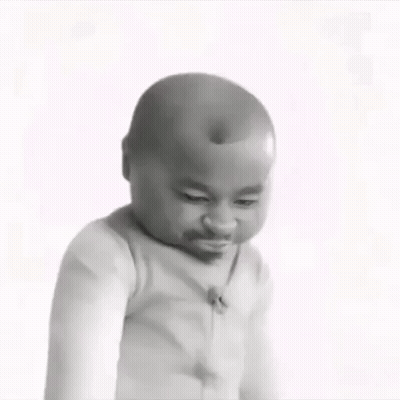 A Black And White Photo Of A Baby Making A Funny Face With His Eyes Closed . GIF