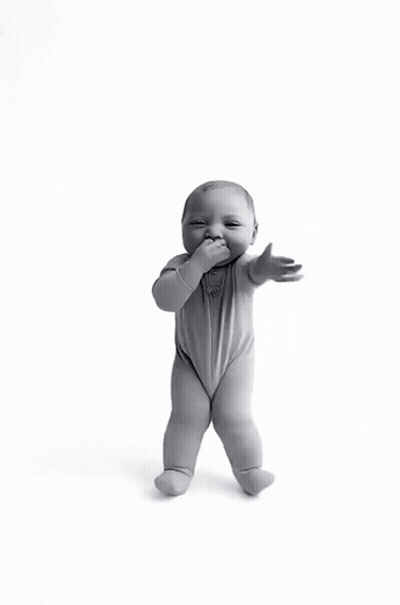A Black And White Photo Of A Baby Standing On Its Hind Legs GIF