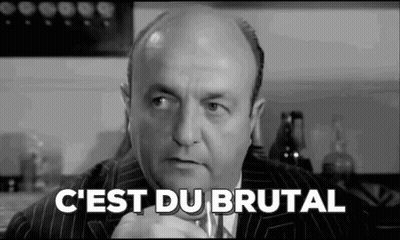 A Black And White Photo Of A Bald Man In A Suit And Tie With The Words `` C'est Du Brutal '' Written On It . GIF