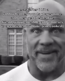 A Black And White Photo Of A Bald Man With A Beard Talking About Roblox Battlegrounds GIF