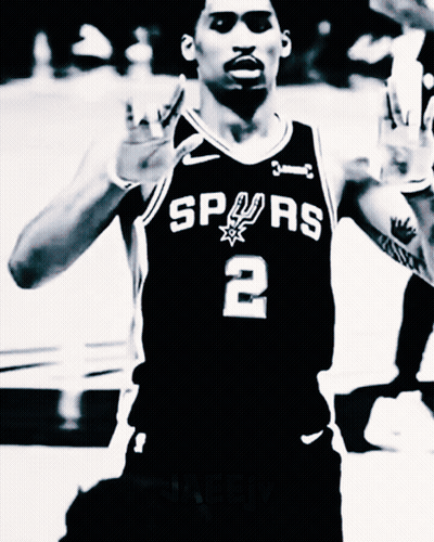 A Black And White Photo Of A Basketball Player Wearing A Spurs Jersey GIF