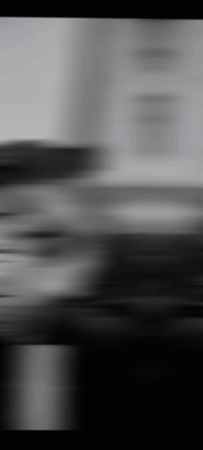 A Black And White Photo Of A Blurred Background With A Few Lines Coming Out Of It . GIF