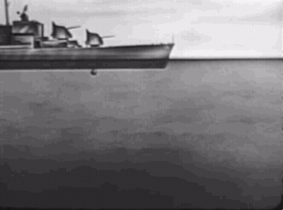 A Black And White Photo Of A Boat Floating On Top Of A Large Body Of Water . GIF