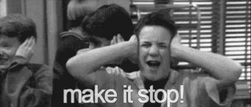 A Black And White Photo Of A Boy Covering His Ears With His Hands And The Words `` Make It Stop ! '' GIF