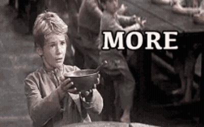 A Black And White Photo Of A Boy Holding A Bowl With The Word More Written On It . GIF