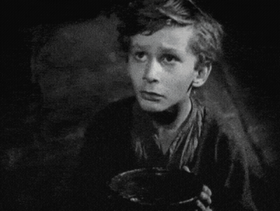 A Black And White Photo Of A Boy Holding A Bowl With The Words Please Sir Behind Him GIF