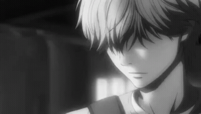 A Black And White Photo Of A Boy With A Backpack Looking Down . GIF