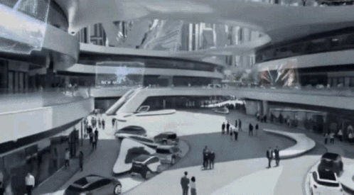 A Black And White Photo Of A Building With Cars Parked In The Middle GIF
