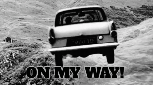 A Black And White Photo Of A Car With The Words On My Way Written Below It GIF