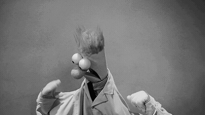 A Black And White Photo Of A Cartoon Character In A Lab Coat And Tie . GIF