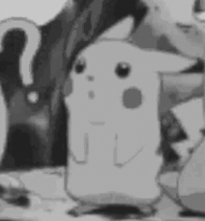 A Black And White Photo Of A Cartoon Character Standing Next To A Person . GIF