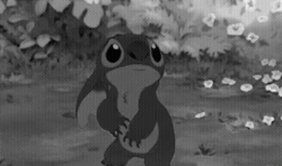 A Black And White Photo Of A Cartoon Character Stitch GIF