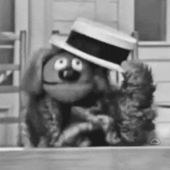 A Black And White Photo Of A Cartoon Character Wearing A Top Hat GIF