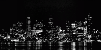 A Black And White Photo Of A City Skyline At Night Taken By Great-Freedom GIF