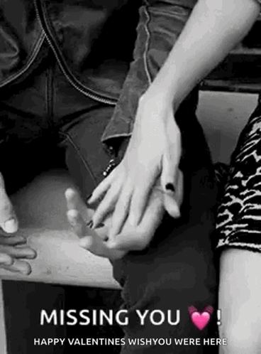 A Black And White Photo Of A Couple Holding Hands . GIF