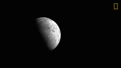 A Black And White Photo Of A Crescent Moon In The Night Sky GIF